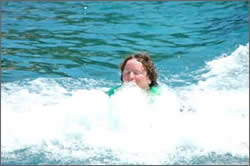 Anita being dragged by dolphin