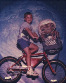 Andrew riding on ET's bike